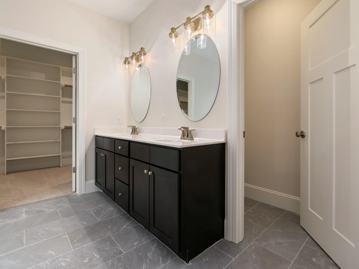 Modern bathroom with dark walls painted by Winchester Decorators