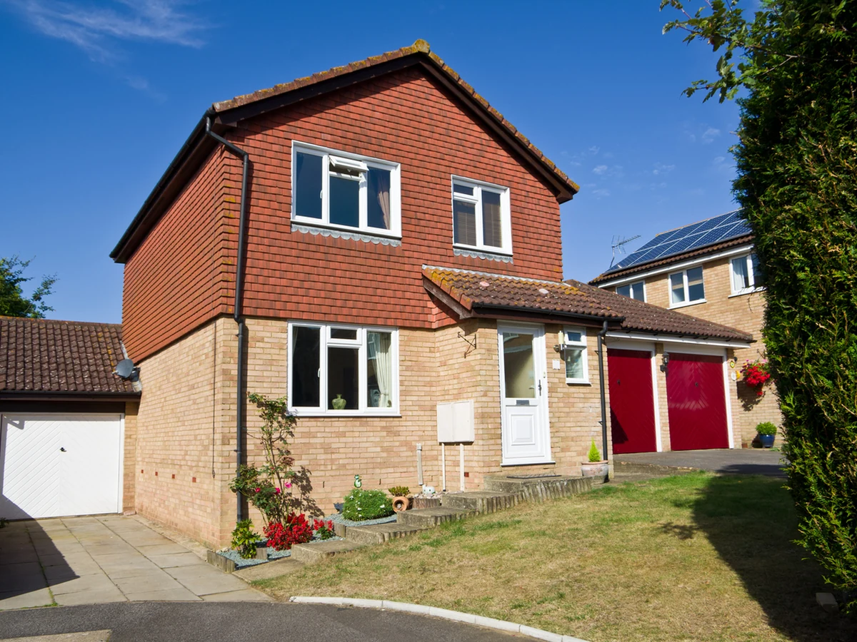 Exterior painting on detached red brick property in Winchester by Winchester Decorators