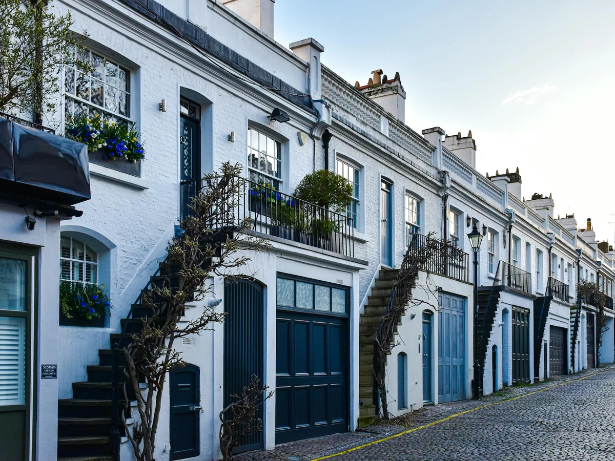 White rendered mews houses painted by Winchester Decorators in Hampshire