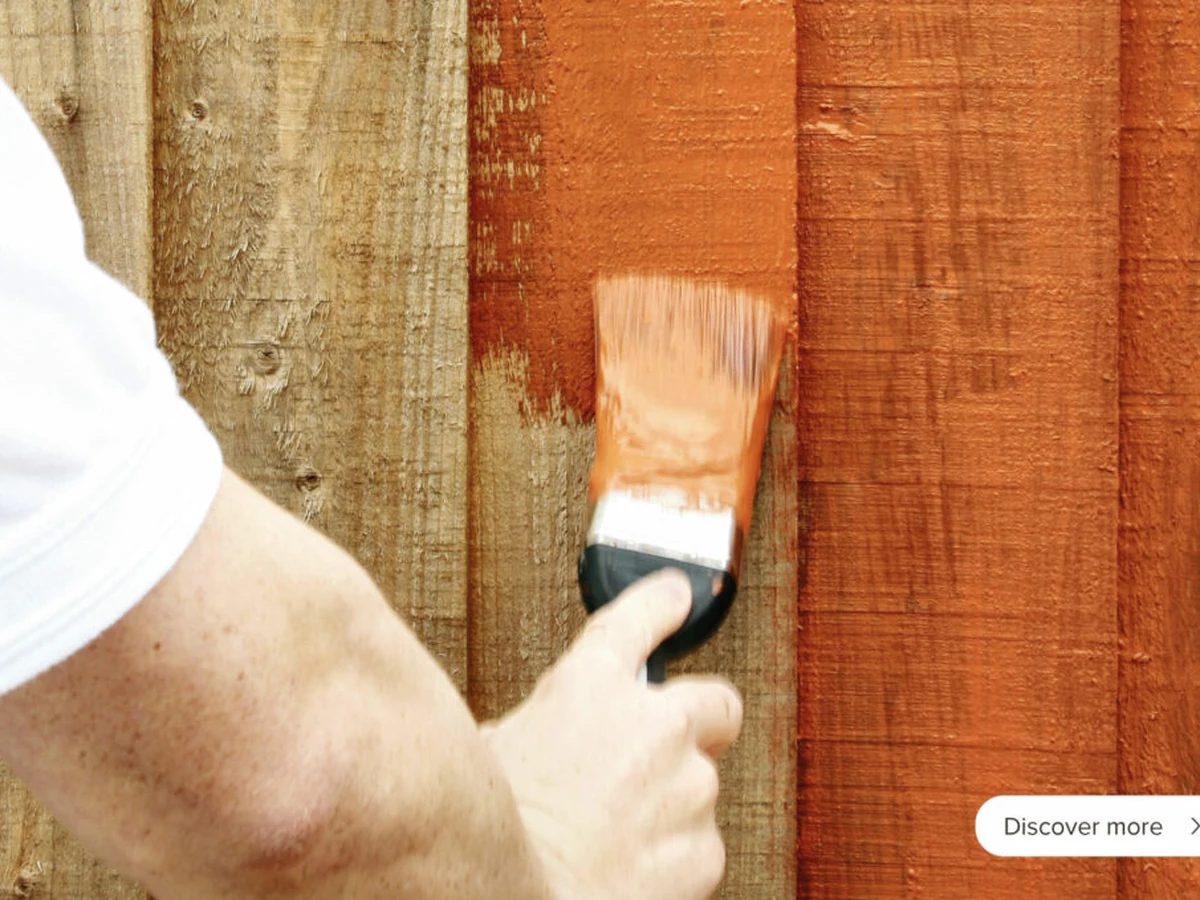 Fence Painting Hand Brushing Orange by Winchester Decorators in Winchester