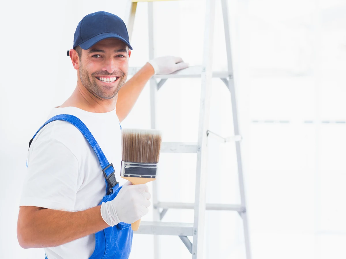 Painting Decorating Smiling Painter Holding by Winchester Decorators in Winchester